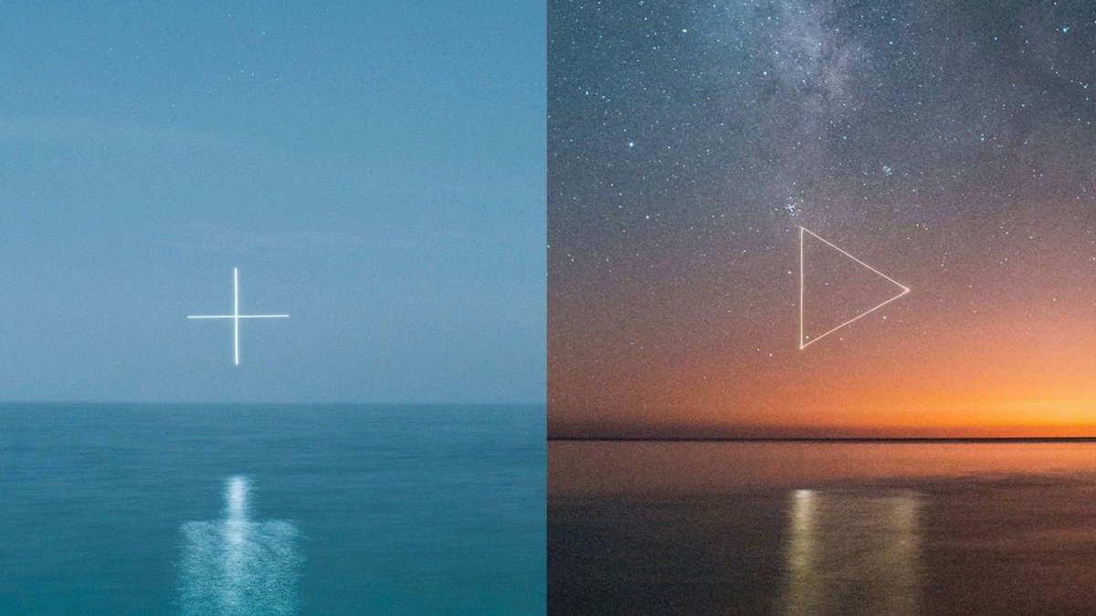 Photographer uses a drone to create glowing symbols over water