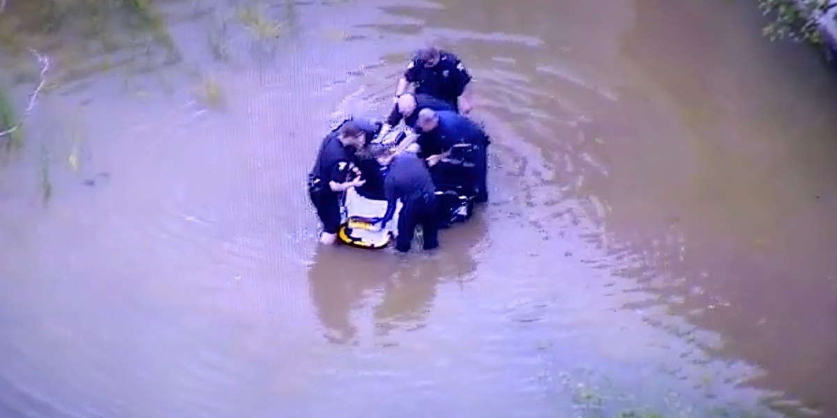 Drone records rescue of man in wheelchair stuck in rising floodwaters