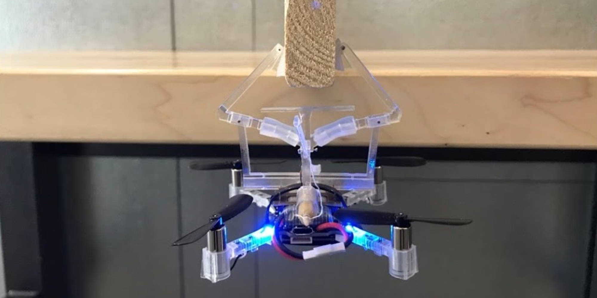 This drone can hang onto objects with a mechanical gripper