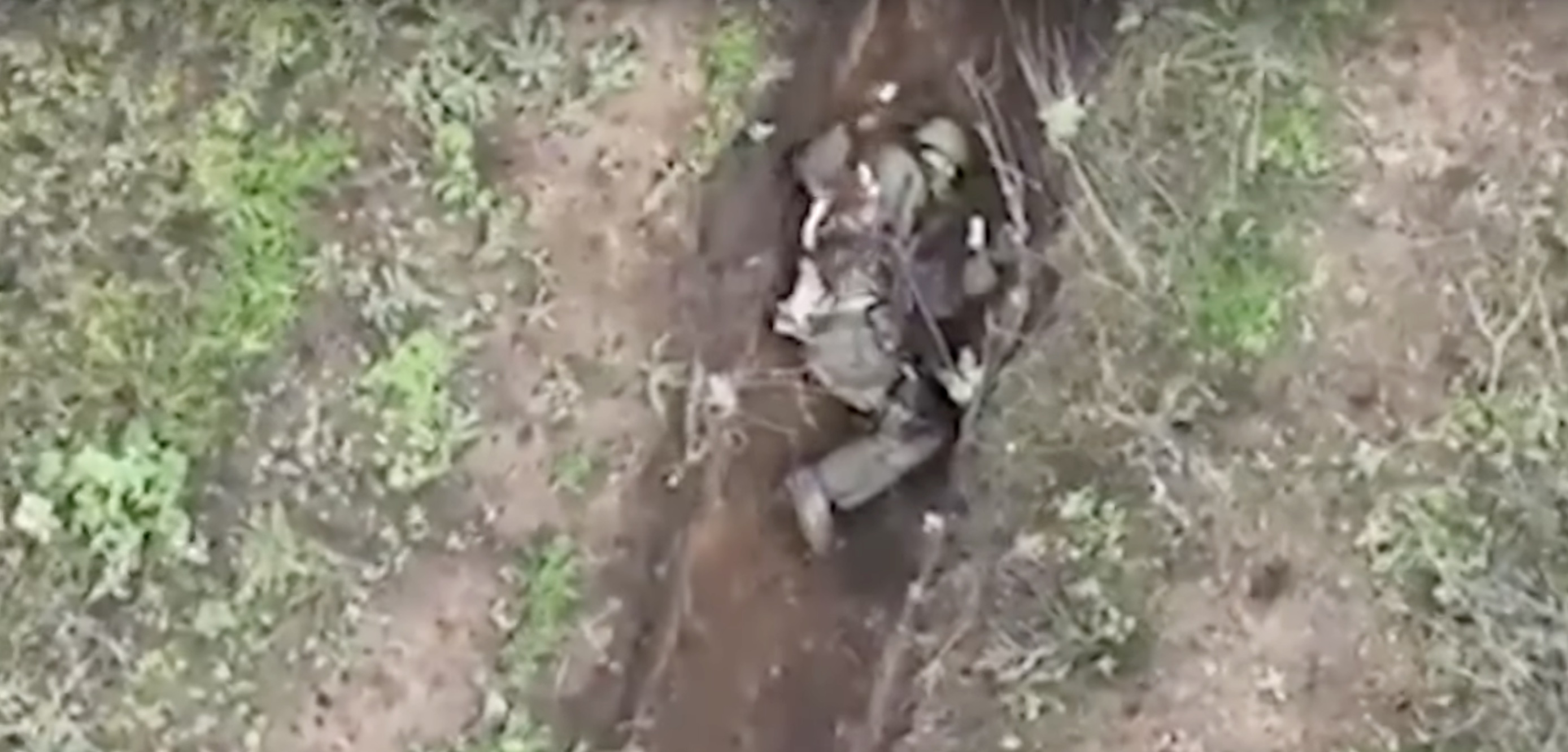 Russian soldier tosses grenades dropped by Ukraine drone: video